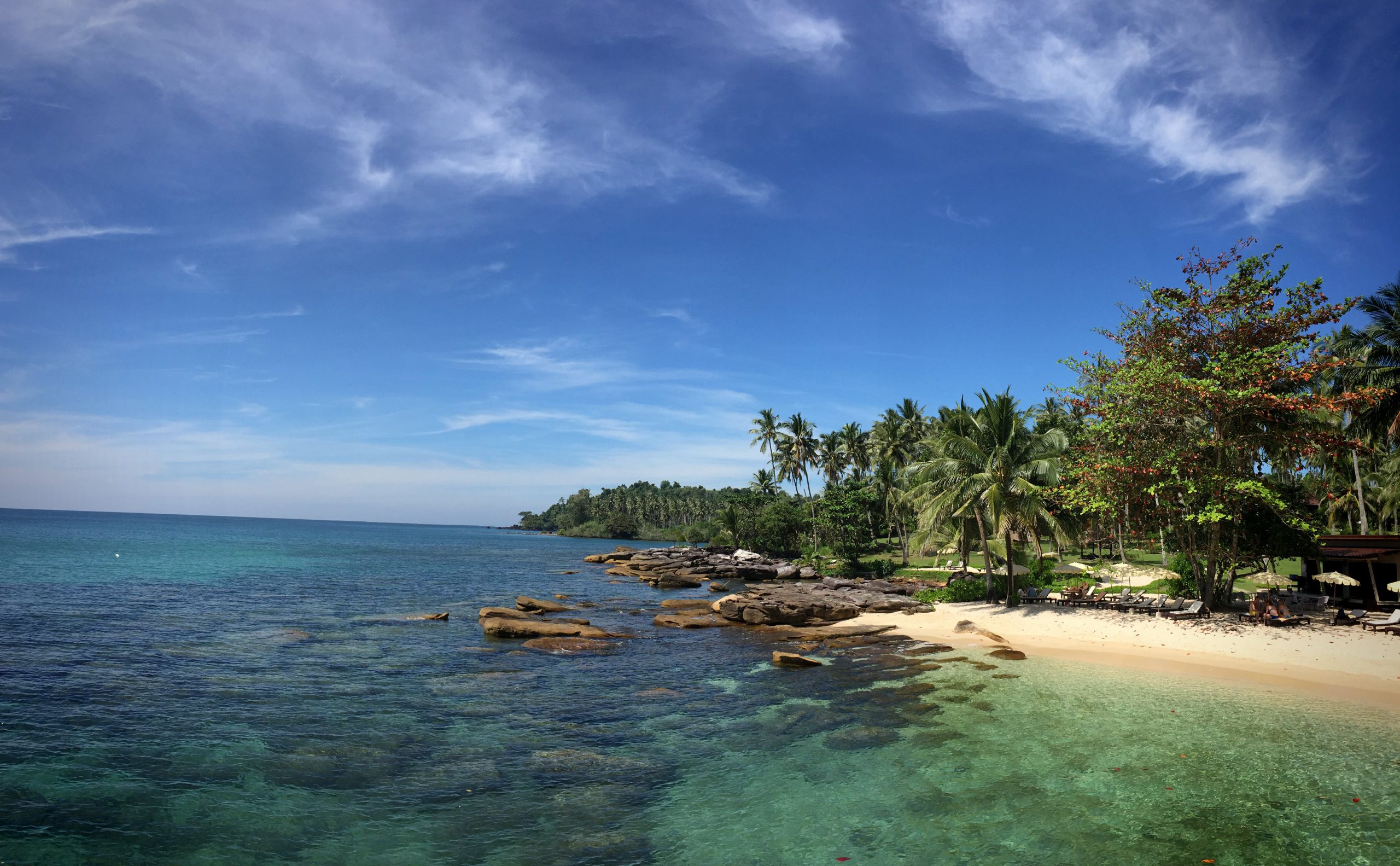 Aerial view of pristine tropical island coastline